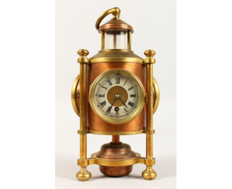 A RARE BRASS LIGHTHOUSE CLOCK, with three dials, clock, thermometer and barometer, each 2.5ins diameter, the case with ring h