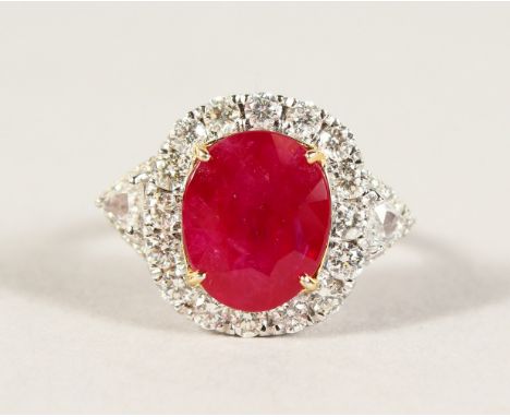 AN 18CT WHITE GOLD, RUBY AND DIAMOND CLUSTER RING of 5cts approx.