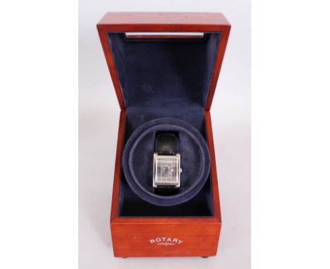 A GENTLEMAN'S ROTARY WRISTWATCH, with leather strap, in a folding wooden box.