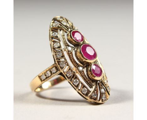 A GOOD 9CT GOLD THREE-STONE RUBY AND DIAMOND SET OVAL RING.