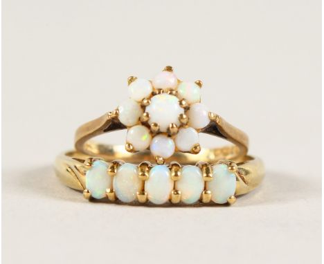 A 9CT GOLD FIVE-STONE OPAL RING and A CLUSTER RING (4).