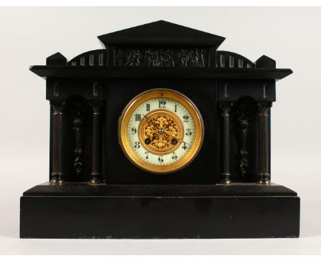 A GOOD VICTORIAN BLACK MARBLE MANTLE CLOCK, formed as a classical building with Corinthian columns. 15ins long x 12ins high.