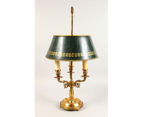 A GOOD TOLEWARE THREE LIGHT LAMP, with green Tole shade, on a circular base.