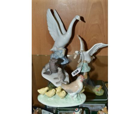 A SMALL GROUP OF LLADRO AND NAO comprising Lladro Duck taking flight No1264 and mini Seal Family No 5318 and Nao Swan in Flig