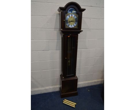 A FRANZ HERMLE MAHOGANY LONGCASE CLOCK, the arched brass and silvered dial with a automaton movement to the arch, lever for W