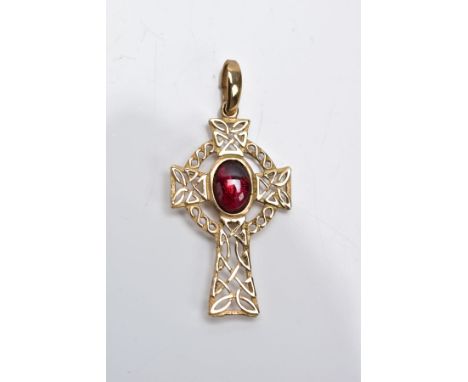 A 9CT GOLD CELTIC CROSS PENDANT, of an openwork design set with a central red paste cabochon fitted with a plain polished tap