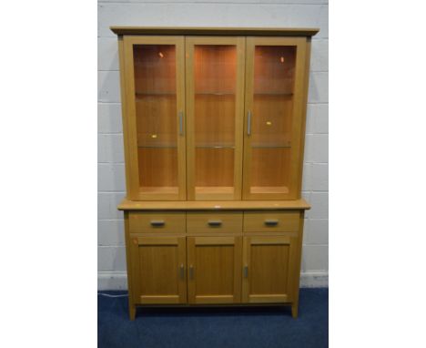 A MORRIS FURNITURE COMPANY, RANGE HORIZON, LIGHT OAK GLAZED THREE DOOR DRESSER, two glass shelves, internal lighting, with th