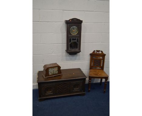 AN EDWARDIAN WALNUT HALL CHAIR, together with an oak wall clock, oak blanket chest (sd) and an Art Deco mantel clock (sd and 
