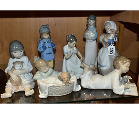 SEVEN NAO FIGURES/GROUPS, comprising Girl carrying lamb, height 20cm, 'Repeat After Me' No 1285 (boy reading to puppy), lengt