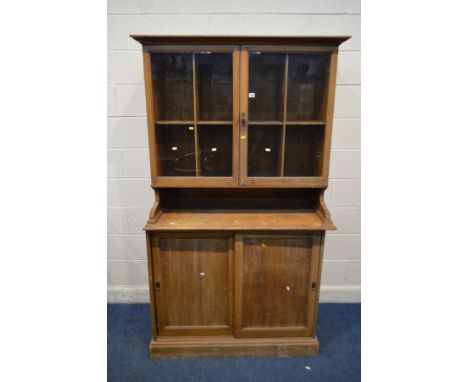 AN EARLY 20TH CENTURY LIGHT OAK CUPBOARD, double glazed cupboard top above double sliding doors, width 113cm x depth 60cm x h