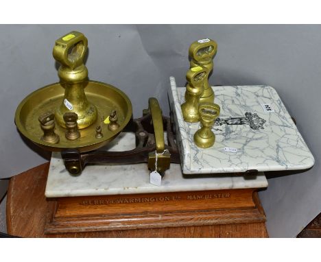 A SET OF BERRY AND WARMINGTON BALANCE SCALES, mantel on a marble topped wooden plinth, retail scales with marble slab for wei