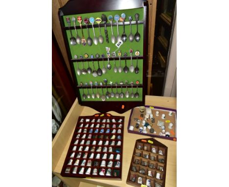 THREE WOODEN DISPLAY SHELVES OF METAL AND CERAMIC THIMBLES AND SOUVENIR SPOONS, together with a small box of ceramic thimbles