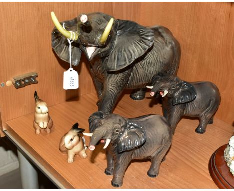 A GROUP OF BESWICK, comprising three Elephants, two small No 974 with trunks stretched (one with reglued tusk, the other with