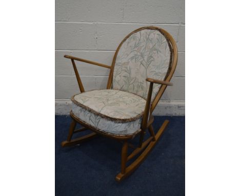 A BLONDE ERCOL MODEL 315 WINDSOR GRANDFATHER ROCKING CHAIR