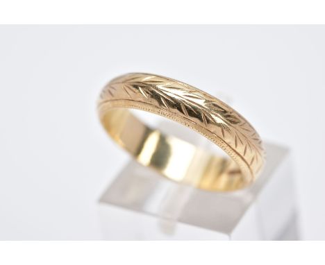 A 9CT GOLD BAND, engraved with a decorative chevron pattern all round, hallmarked 9ct gold Birmingham, ring size P, approxima