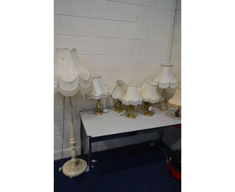 A PAINTED STANDARD LAMP, along with six various brassed table lamps, two onyx table lamps, all with fabric shades, green grou