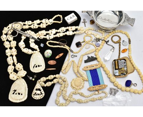 A SELECTION OF CARVED BONE BEAD NECKLACES, PAIR OF MANICURE SCISSORS, A KEYRING, SILVER CROSS PENDANT, A WHITE METAL DISH, et