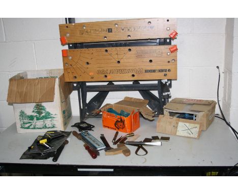 A BLACK AND DECKER WORKKMATE 750 and a box containing tools including a mitre block, mitre clamps, voltage tester, etc (2)