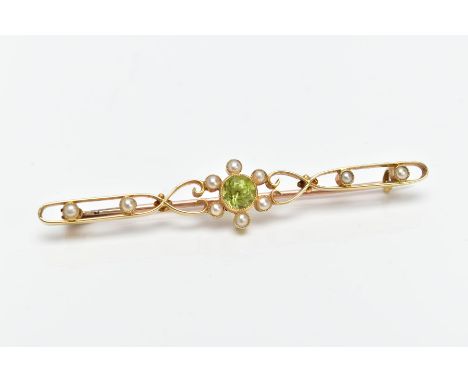 A YELLOW METAL, PERIDOT AND SPLIT PEARL BROOCH, designed with a central circular cut collet set peridot  within a split pearl
