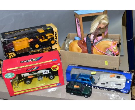 A BOXED BRITAINS ROBERT WISEMAN DAIRIES MILK TANKER. No 09599, two boxed J.C.B. Junior Fastrac and Trailer models, quantity o