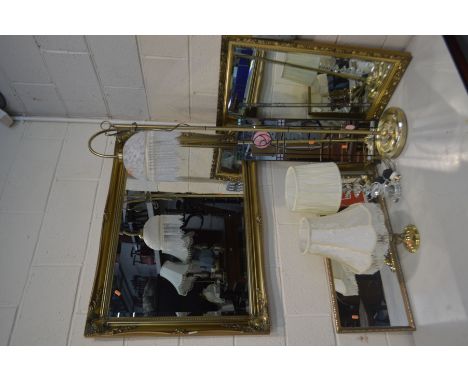 A LARGE MODERN GILT FRAMED BEVELLED EDGE WALL MIRROR, 106cm x 75cm, and three other wall mirrors, together with a modern bras