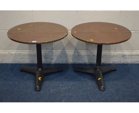 A PAIR OF CIRCULAR COPPER TOPPED LAMP TABLES, on a cast iron base, diameter 55cm x height 49cm (2)