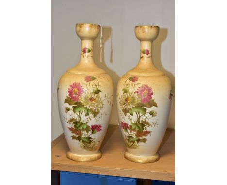 A PAIR OF WILTSHAW &amp; ROBINSON (LTD) CARLTON WORKS IVORY GROUND BALUSTER VASES, printed and painted with the 'Chrysanthemu