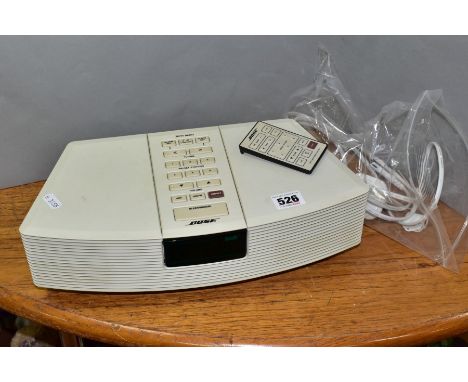 A BOSE WAVE RADIO, model number AWR132 with remote control and power cable
