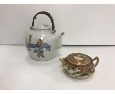 A 19th Century Chinese polychrome decorated teapot with figural decoration depicting "Various figures in an interior setting 