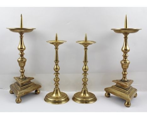 TWO PAIRS OF 17TH CENTURY DESIGN BRONZE PRICKET CANDLESTICKS, tallest pair 38cm high to tip of the point 