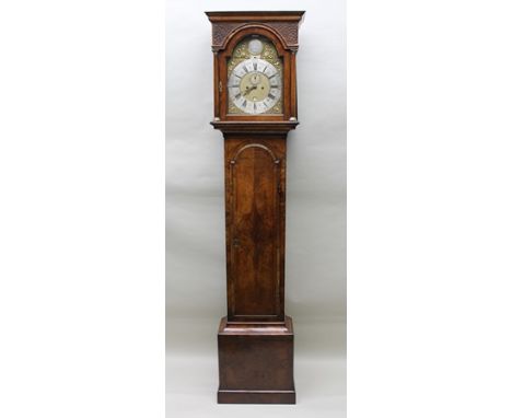 MARK JACOB OF LONDON A WALNUT LONGCASE CLOCK the hood with blind fret panel decoration and brass capped columns flanking an a