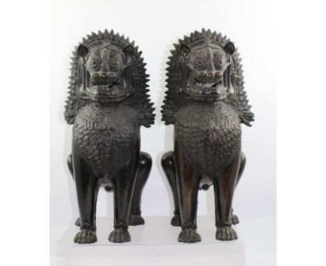 A PAIR OF LATE 20TH CENTURY BRONZE TEMPLE LIONS, 40cm high 
