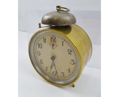 AN "ANSONIA" USA BRASS CASED ALARM CLOCK, bell mounted to top, with ring handle, the dial with Arabic numerals, circa 1900, 1