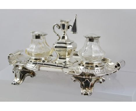 HENRY WILKINSON A VICTORIAN SILVER DESK STAND having central taper holder and snuffer, twin faceted silver topped cut glass r