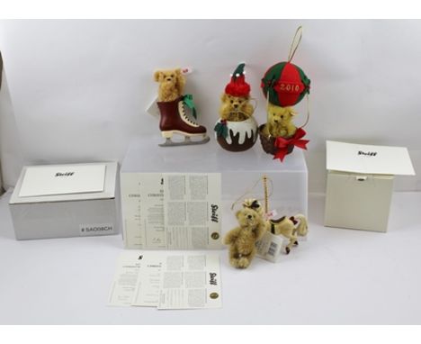 A COLLECTION OF FOUR STEIFF CHRISTMAS ORNAMENT BEARS, bearing dates, ear stud and white tags, two of the bears have boxes and