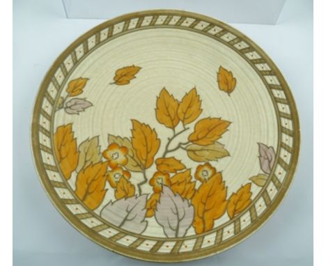 CHARLOTTE RHEAD A POTTERY WALL CHARGER "Golden Leaves", tube lined and hand painted for the Crown Ducal range of A.G. Richard