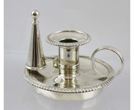 A GEORGE III SILVER TAPER HOLDER with snuffer of chamber stick design, from a Standish, having gadrooned rim and ring handle,