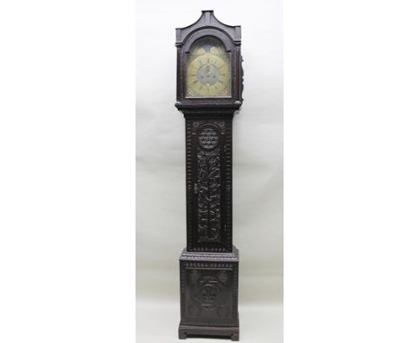 JAMES CLARK OF FROME A CARVED OAK LONGCASE CLOCK the hood with columns flanking the brass arched top moon phase dial, with ca