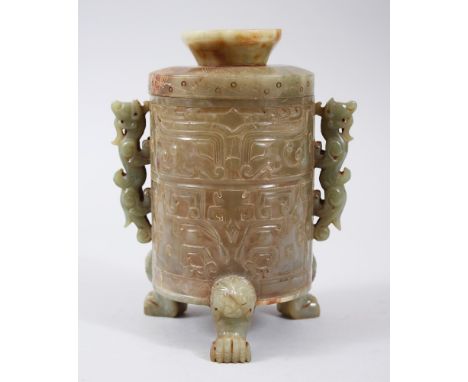 A GOOD CHINESE CARVED JADE JAR AND COVER, with carved decoration of geometric style, with twin chilong handles and lion dog h