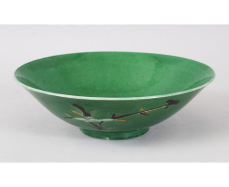 A GOOD CHINESE GREEN GROUND KANGXI BOWL, the interior decorated with a tree design, the exterior with floral design, the base
