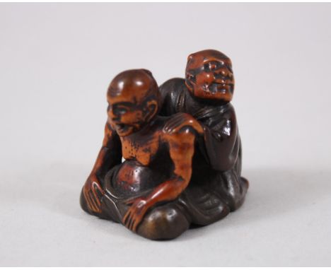 A GOOD JAPANESE EDO PERIOD WOOD &amp; LACQUER NETSUKE OF BLIND MASSEUR, the blind masseur working, the clothing of the figure