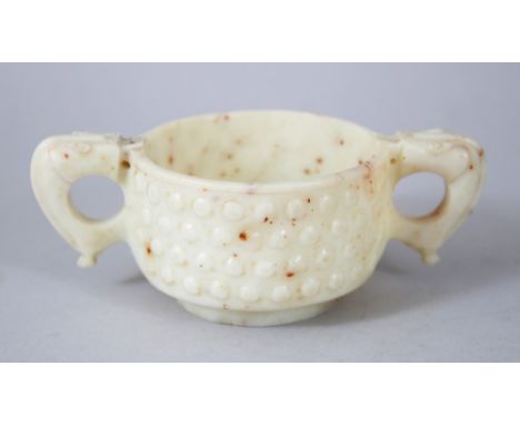 A 20TH CENTURY CHINESE ARCHAIC STYLE JADE / SOAPSTONE MING STYLE CUP, 13.5cm wide including handles, 7.5cm diameter , 5cm hig