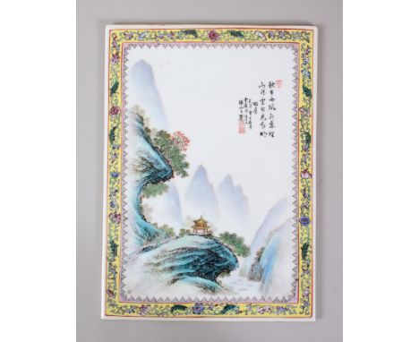 A CHINESE REPUBLICAN STYLE FAMILLE ROSE PORCELAIN PANEL / TILE, decorated with scenes of temples amongst mountains, with bord