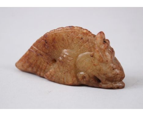 A GOOD CHINESE 19TH / 20TH CENTURY CARVED JADE FISH DRAGON PENDANT / FIGURE, carved in the form of a leaping koi carp dragon,