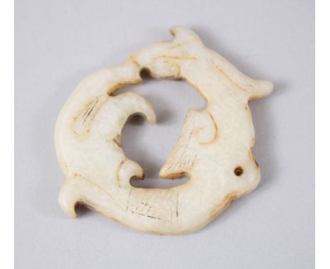 A 19TH / 20TH CENTURY CHINESE CARVED JADE PENDANT OF A DRAGON, 4.6cm diameter.