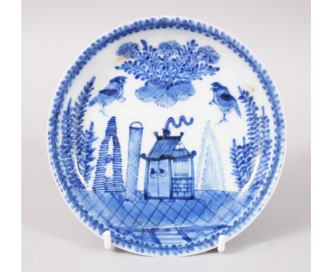 A CHINESE KANGXI BLUE &amp; WHITE PORCELAIN SAUCER DISH, the saucer depicting a landscape scene with birds, the base bearing 