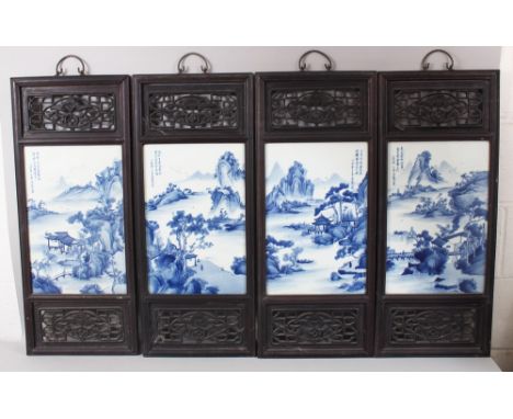 A SET OF FOUR 19TH / 20TH CENTURY CHINESE BLUE &amp; WHITE PORCELAIN FRAMED PANELS, each panel depicting landscape scenes, ea