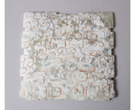 A 19TH / 20TH CENTURY CHINESE CARVED SNOWFLAKE JADE PLAQUE / PENDANT, carved with archaic style design, 13cm square