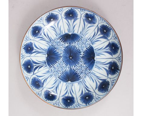 A GOOD CHINESE BLUE &amp; WHITE KANGXI PORCELAIN SAUCER DISH, decorated with floral decoration, 22.5cm diameter.