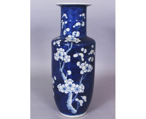 A 19TH CENTURY CHINESE BLUE &amp; WHITE ROULEAU PORCELAIN VASE, the sides painted with prunus blossom reserved in white again